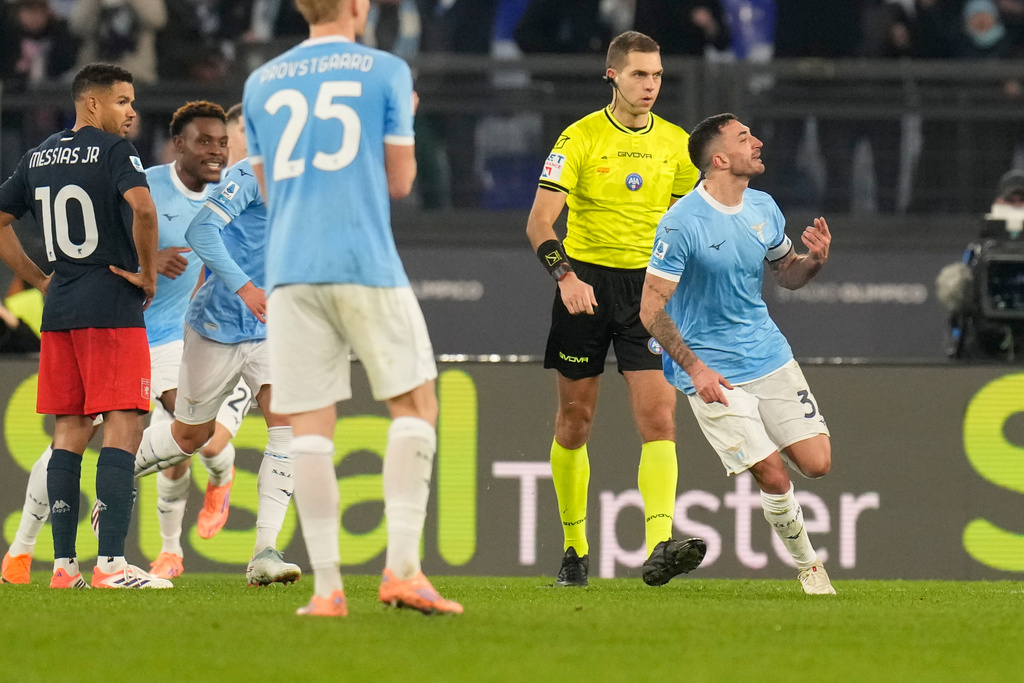 Lazio's Danilo Cataldi, right, celebrates after scoring his side's third goal during the Serie A soccer match between Lazio and Genoa in Rome, Italy, Friday, Jan. 30, 2026. (AP Photo/Gregorio Borgia)