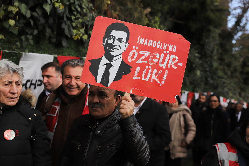 Supporters gather outside Silivri prison, where Istanbul jailed Mayor Ekrem Imamoglu stands trial accused of widespread corruption, west of Istanbul, Turkey, Monday, March 9, 2026. The poster reads in Turkish: "Ekrem Imamoglu freedom". (AP Photo/Dilara Acikgoz)