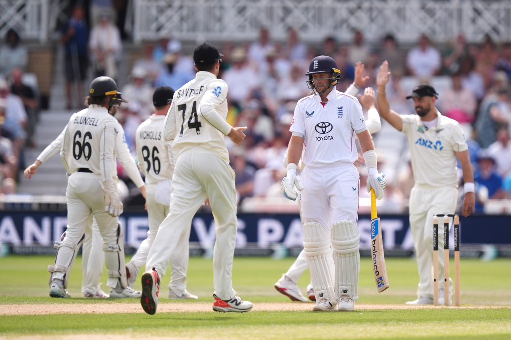England's Joe Root, center right, reacts after being bowled out by New Zealand's Nathan Smith via lbw during day three of the Third Test cricket match between England and New Zealand, in Nottingham, England, Saturday June 27, 2026. (Mike Egerton/PA via AP)