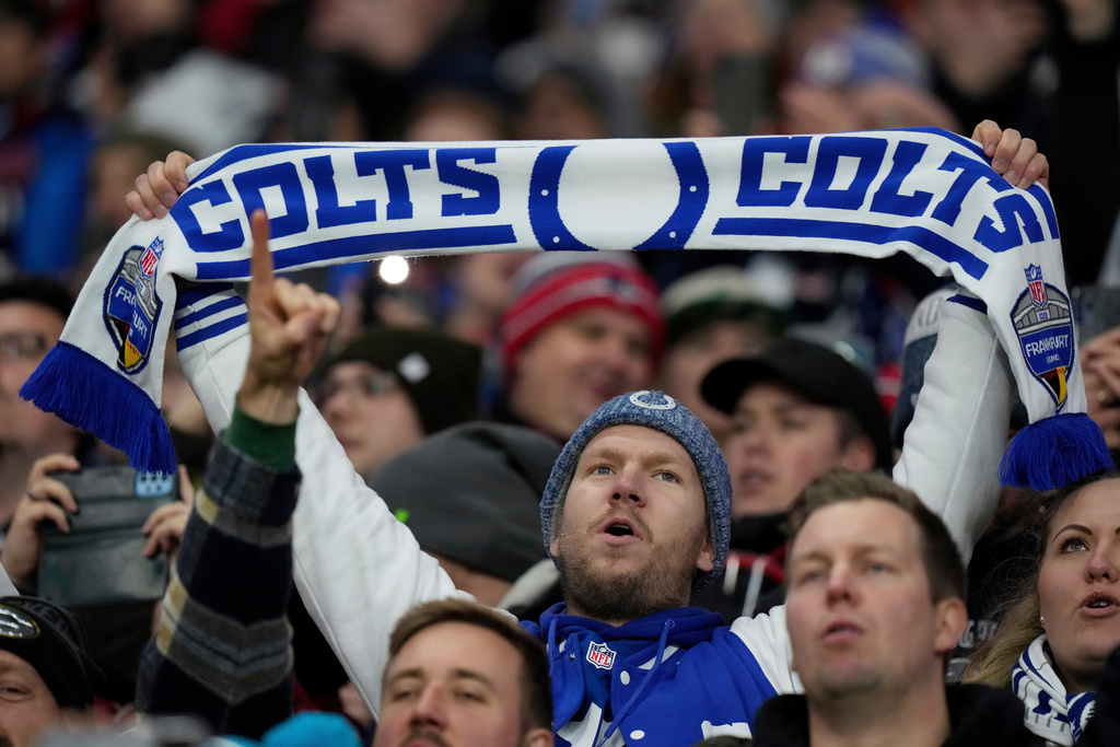 FILE - Fans cheer as the Indianapolis Colts take on New England Patriots during an NFL football game at Deutsche Bank Park Stadium in Frankfurt, Germany, Nov. 12, 2023. (AP Photo/Doug Benc, File)