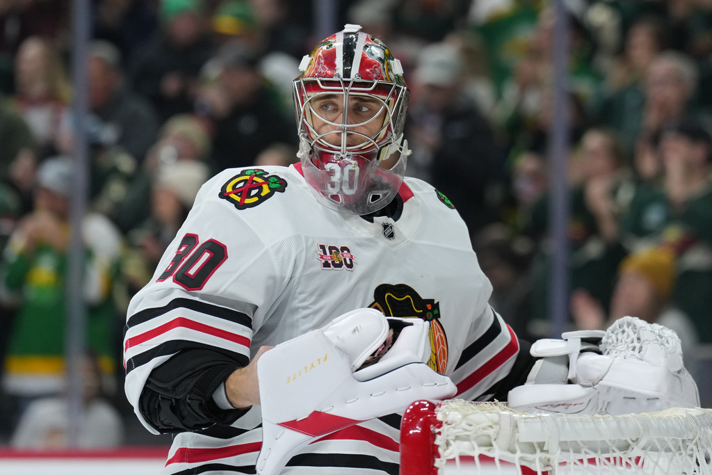 Chicago Blackhawks goaltender Spencer Knight (30) stands by the goal after a goal scored by Minnesota Wild center Joel Eriksson Ek (14) during the third period of an NHL hockey game, Tuesday, Jan. 27, 2026, in St. Paul, Minn. (AP Photo/Abbie Parr)