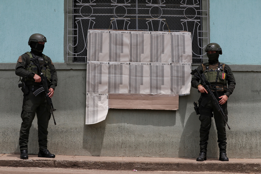 Police guard a polling station in Buenos Aires, Cauca state, Colombia, Sunday, March 8, 2026. (AP Photo/Santiago Saldarriaga)