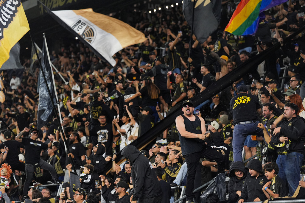 Fans celebrate a goal by LAFC midfielder Timothy Tillman during the second half of the first leg of a CONCACAF Champions Cup semifinal soccer match against Toluca Wednesday, April 29, 2026, in Los Angeles. (AP Photo/Jae C. Hong)