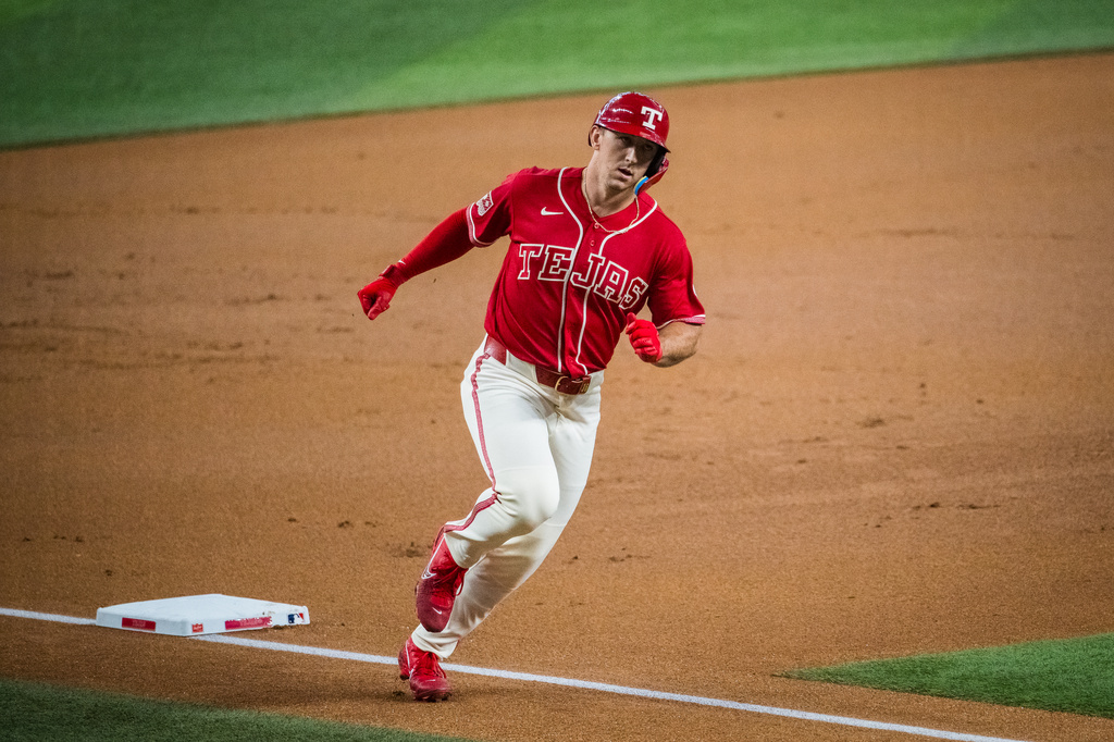 Texas Rangers' Wyatt Langford rounds the bases after hitting a home run during the first inning of a baseball game against the Seattle Mariners, Friday, July 24, 2026, Arlington, Texas. (AP Photo/Jessica Tobias)