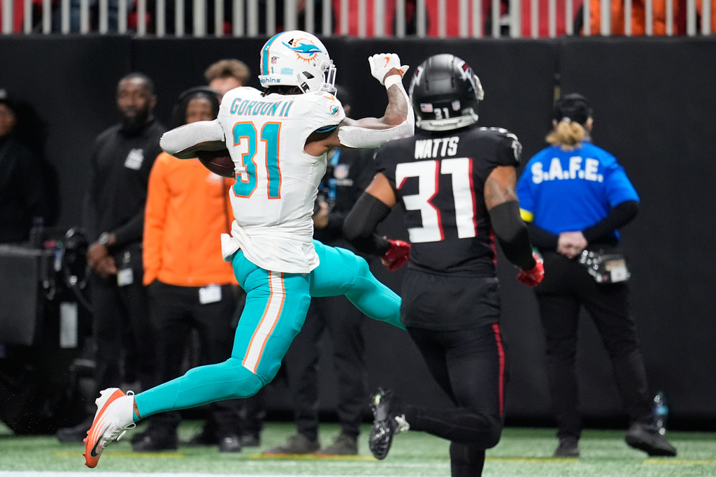 Miami Dolphins running back Ollie Gordon II (31) scores a touchdown during the second half of an NFL football game against the Atlanta Falcons, Sunday, Oct. 26, 2025, in Atlanta. (AP Photo/Mike Stewart)