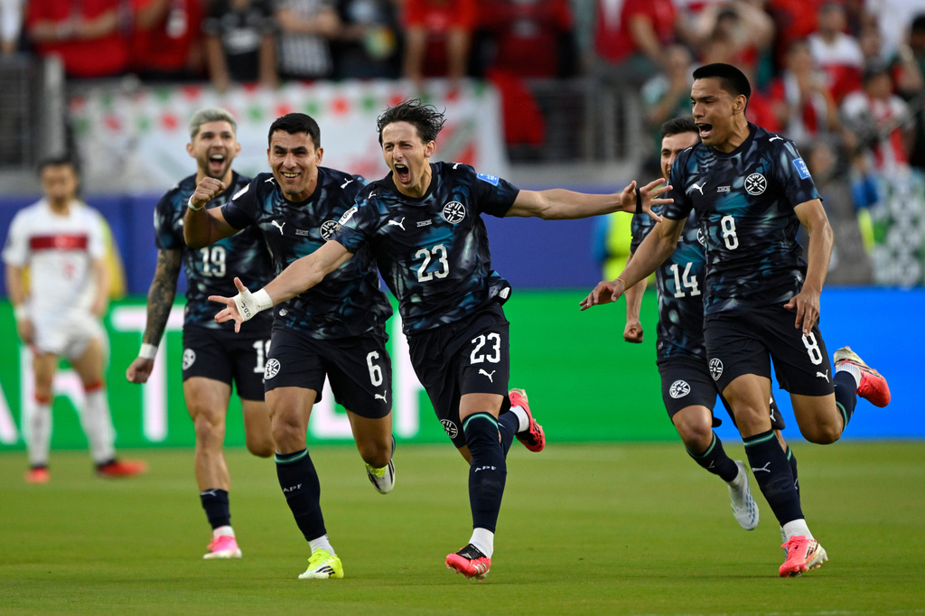 Paraguay's Matias Galarza (23) celebrates with Junior Alonso (6) and Diego Gomez (8) after scoring their opening goal during the World Cup Group D soccer match between Turkey and Paraguay in Santa Clara, Calif., near San Francisco, Friday, June 19, 2026. (AP Photo/Eakin Howard)