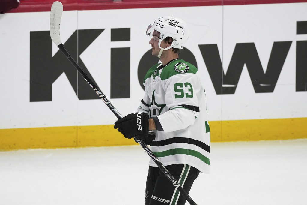 Dallas Stars center Wyatt Johnston reacts after scoring the winning goal during a shootout in an NHL hockey game against the Colorado Avalanche, Wednesday, March 18, 2026, in Denver. (AP Photo/David Zalubowski)