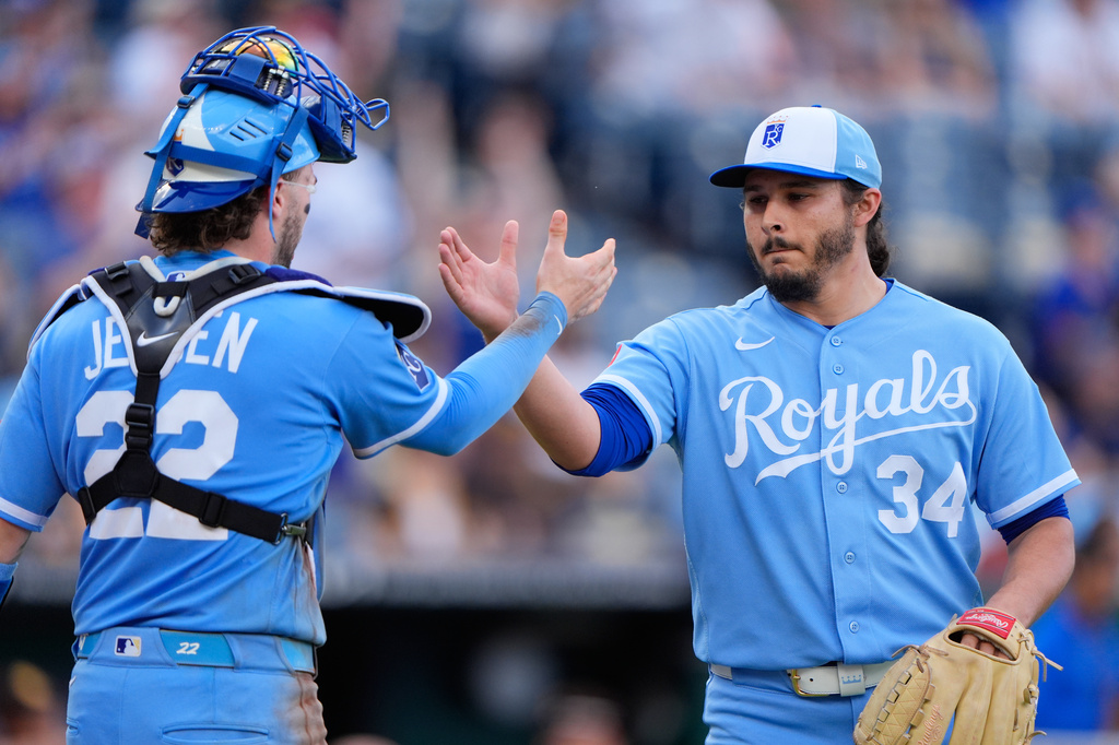 Kansas City Royals pitcher Eli Morgan (34) celebrates with catcher Carter Jensen (22) after their baseball game against the San Diego Padres, Saturday, July 18, 2026, in Kansas City, Mo. (AP Photo/Charlie Riedel)