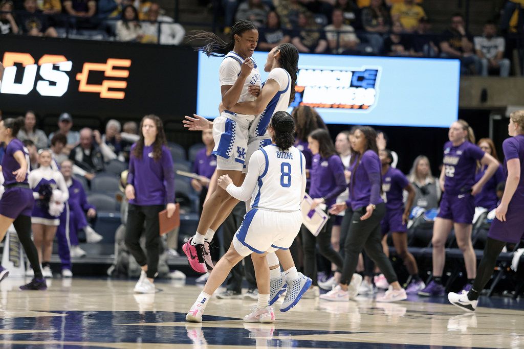 Kentucky players react in the first half against James Madison in the first round of the NCAA college basketball tournament, Saturday, March 21, 2026, in Morgantown, W.Va. (AP Photo/Kathleen Batten)