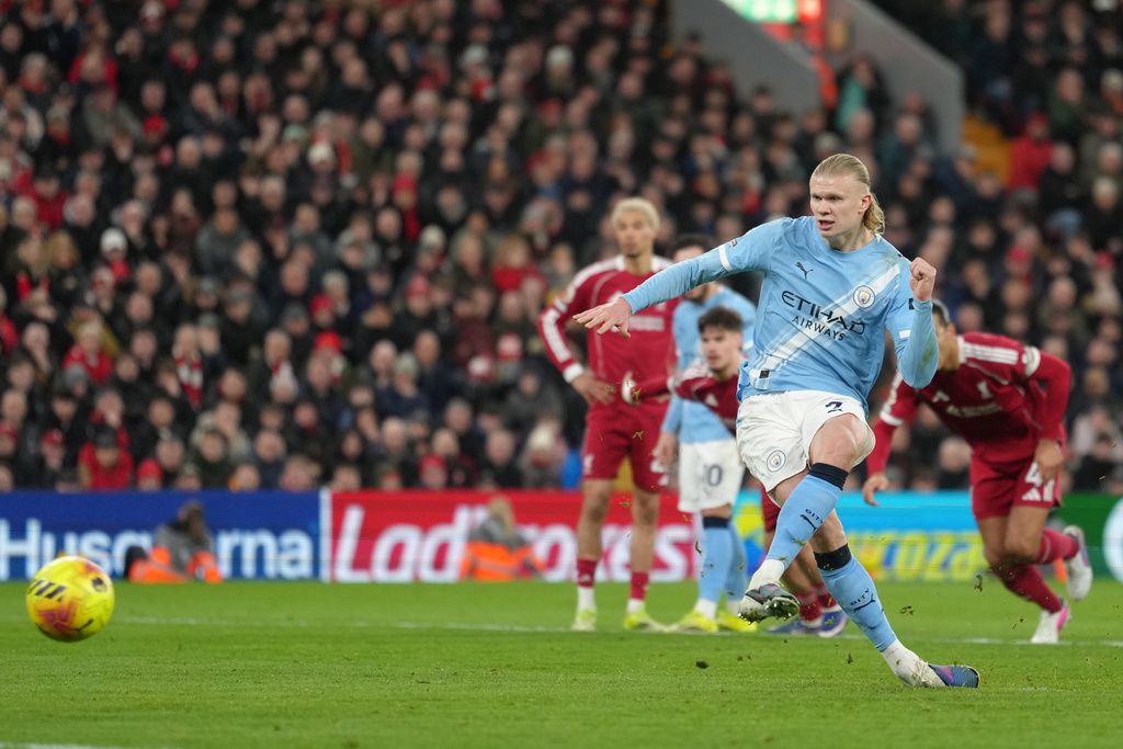 Manchester City's Erling Haaland scores from a penalty kick during the English Premier League soccer match between Liverpool and Manchester City in Liverpool, England, Sunday, Feb. 8, 2026. (AP Photo/Jon Super)