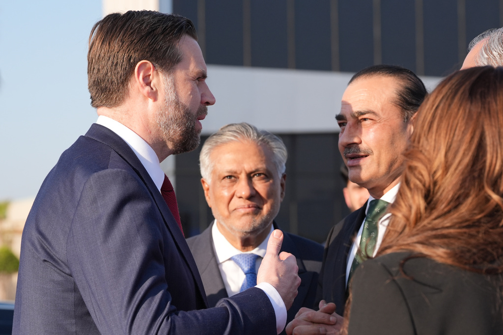Vice President JD Vance, left, talks to Pakistan's Chief of Defence Forces and Chief of Army Staff Field Marshall Asim Munir, right, and Pakistani Deputy Prime Minister and Foreign Minister Mohammad Ishaq Dar, center, before boarding Air Force Two after attending talks on Iran in Islamabad, Pakistan, Sunday, April 12, 2026. (AP Photo/Jacquelyn Martin, Pool)