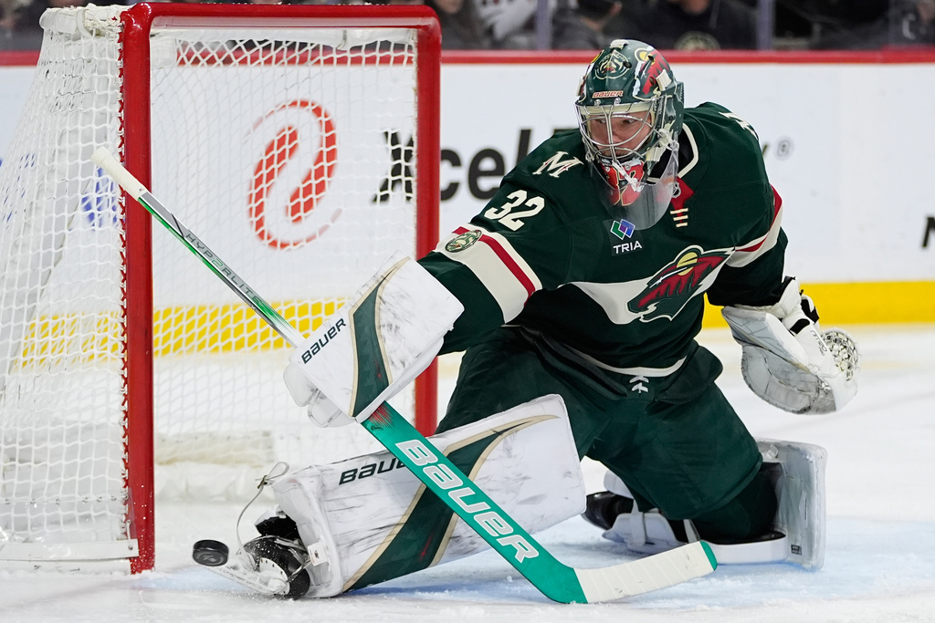 Minnesota Wild goaltender Filip Gustavsson (32) blocks a shot during the second period of an NHL hockey game against the Edmonton Oilers, Saturday, Dec. 20, 2025, in St. Paul, Minn. (AP Photo/Abbie Parr)