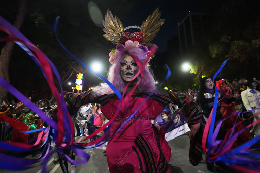 Drag artist Angel Arumir takes part in the annual Day of the Dead Catrina parade in Mexico City, Sunday, Oct. 26, 2025. (AP Photo/Claudia Rosel) Drag artist Angel Arumir takes part in the annual Day of the Dead Catrina parade in Mexico City, Sunday, Oct. 26, 2025. (AP Photo/Claudia Rosel)