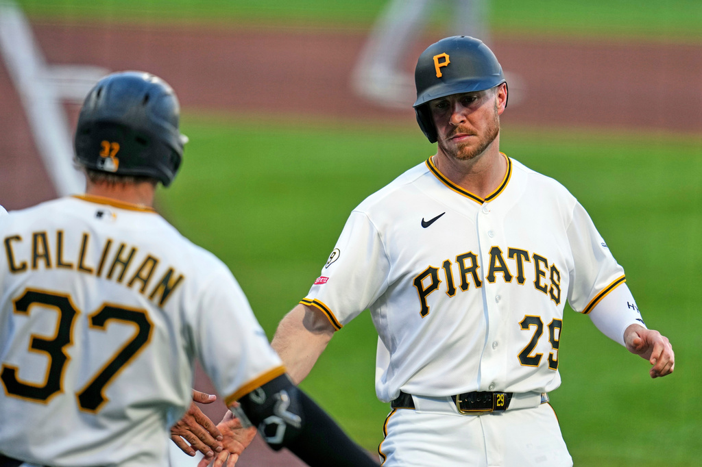 Pittsburgh Pirates' Ryan O'Hearn (29) is greeted by Tyler Callihan (37) after scoring the second of two runs on a double by Endy Rodríguez off Seattle Mariners pitcher Bryan Woo during the fourth inning of a baseball game in Pittsburgh, Wednesday, June 24, 2026. (AP Photo/Gene J. Puskar)