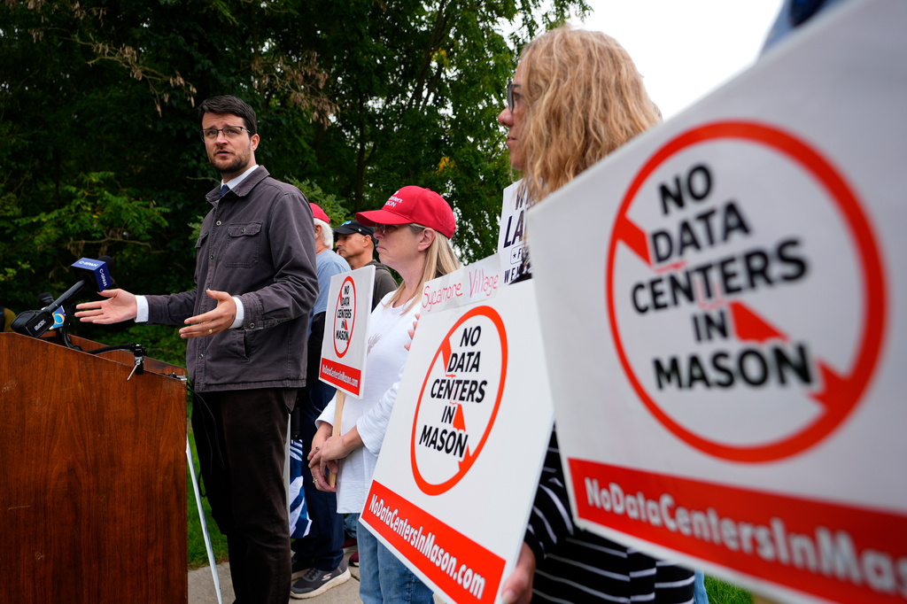 William Lawrence, Democratic candidate for U.S. House of Representatives in Michigan's 7th District, speaks about AI and data centers during a campaign event Thursday, Sept. 17, 2026, in Mason, Mich. (AP Photo/Paul Sancya)