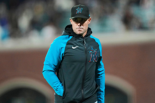 FILE - Miami Marlins manager Skip Schumaker walks off the field during the third inning of a baseball game against the San Francisco Giants= in San Francisco, Friday, Aug. 30, 2024. (AP Photo/Jeff Chiu, File) FILE - Miami Marlins manager Skip Schumaker walks off the field during the third inning of a baseball game against the San Francisco Giants= in San Francisco, Friday, Aug. 30, 2024. (AP Photo/Jeff Chiu, File)