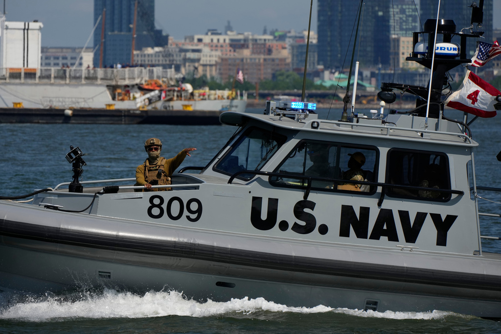 A U.S. Navy boat patrols the New York harbor during Sail250, a gathering of tall ships and military ships, Saturday, July 4, 2026, in New York. (AP Photo/Yuki Iwamura)