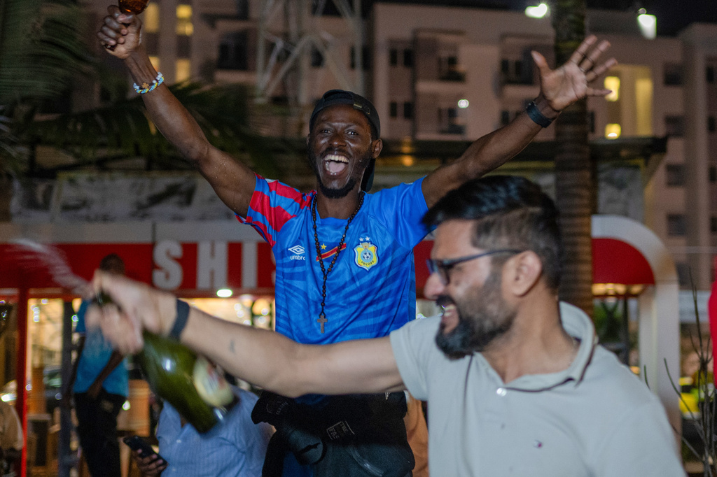Congolese football fans celebrate in Goma, Democratic Republic of the Congo, as their team qualified for World Cup by winning over Jamaica in an intercontinental playoff, Wednesday, April 1, 2026.(AP Photo/Moses Sawasawa)