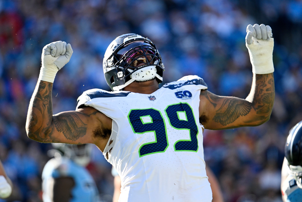 Seattle Seahawks defensive end Leonard Williams celebrates after sacking Tennessee Titans quarterback Cam Ward during the second half of an NFL football game Sunday, Nov. 23, 2025, in Nashville, Tenn. (AP Photo/John Amis)