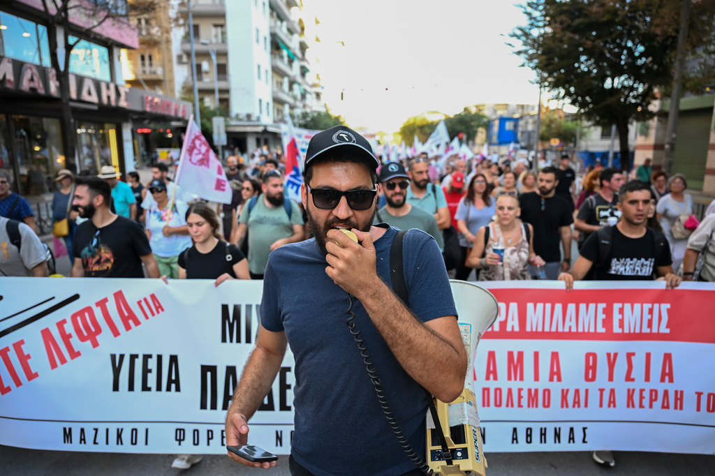 A protester shouts slogans with a megaphone during a protest rally near Thessaloniki's international trade fair, in the northern city of Thessaloniki, Greece, Saturday, Sept. 5, 2026. (AP Photo/Giannis Papanikos)