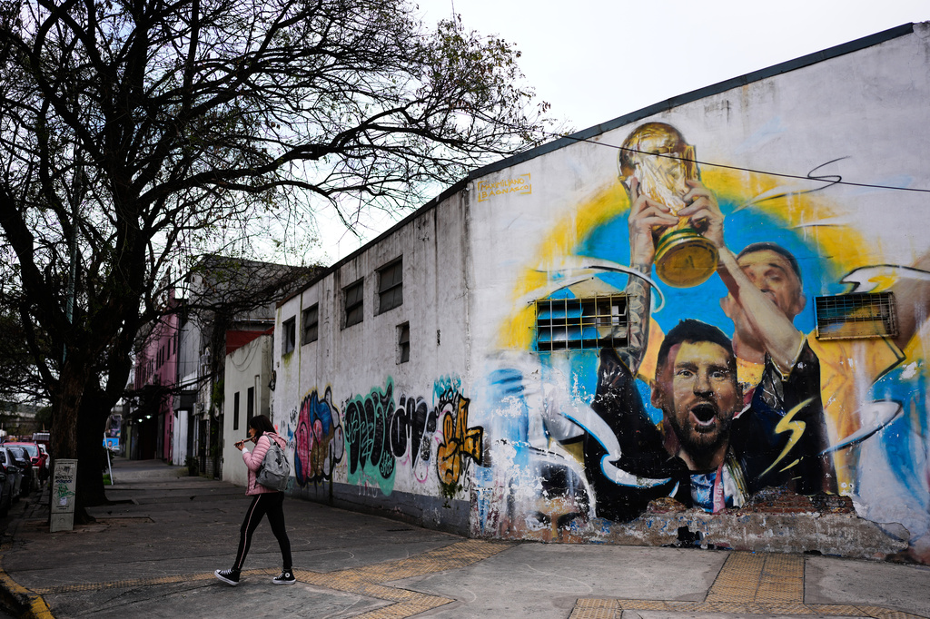 A mural of Argentine soccer player Lionel Messi holding the World Cup trophy covers a building in Buenos Aires, Argentina, Monday, Aug. 31, 2026. (AP Photo/Natacha Pisarenko)