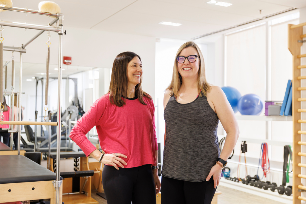 Hilary Granat, left, and her client, Sarah Baldassaro, pose for a portrait at the Center for Orthopedic Rehab and Exercise on Thursday, Jan. 8, 2026, in Washington. (AP Photo/Moriah Ratner)