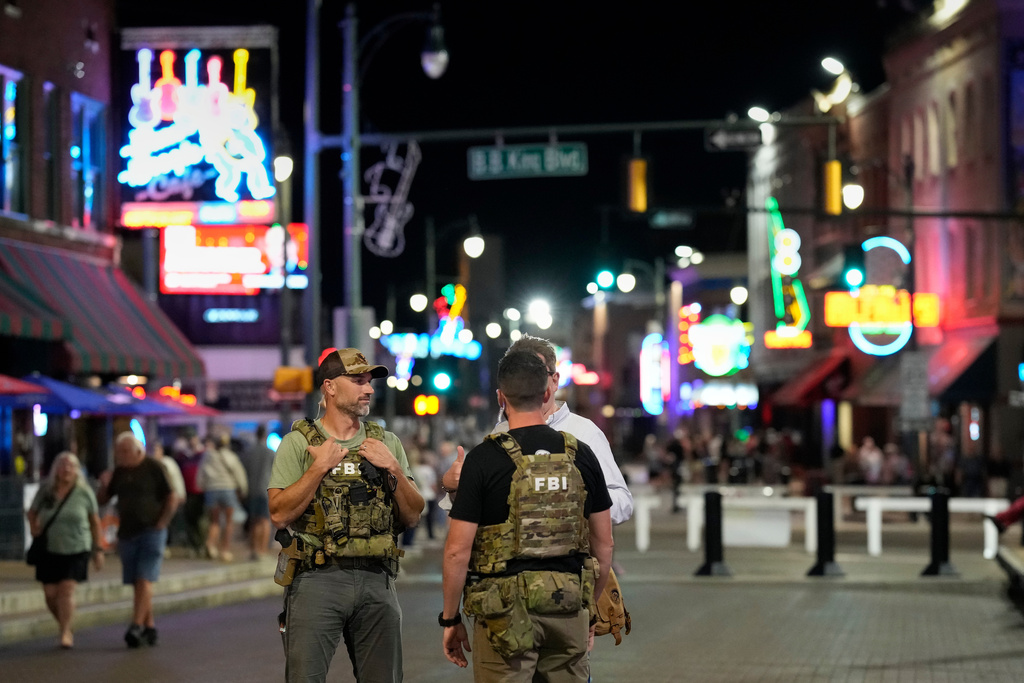 FILE - Federal law enforcement agents walk on Beale Street, Oct. 10, 2025, in Memphis, Tenn. (AP Photo/George Walker IV, File)