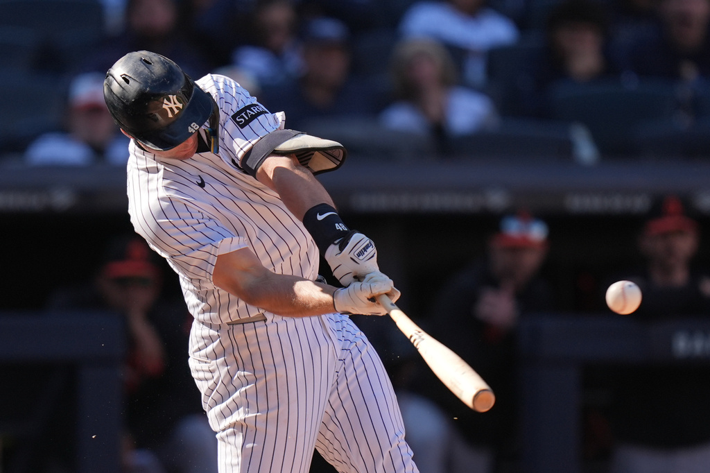 New York Yankees' Paul Goldschmidt hits a two-run single during the eighth inning of a baseball game against the Baltimore Orioles, Sunday, May 3, 2026, in New York. (AP Photo/Seth Wenig)