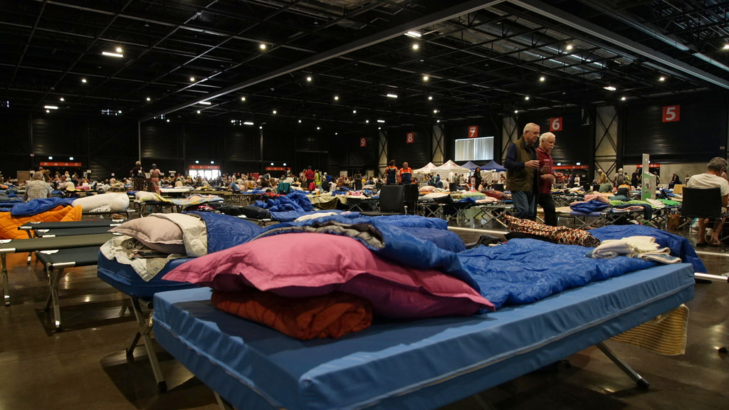 Camp beds for evacuees are laid out in a temporary shelter in Bordeaux, France, Tuesday, July 28, 2026, for some of the 220,000 people who have fled wildfires in France's southwest Gironde region. (AP Photo/Eva van Dam)