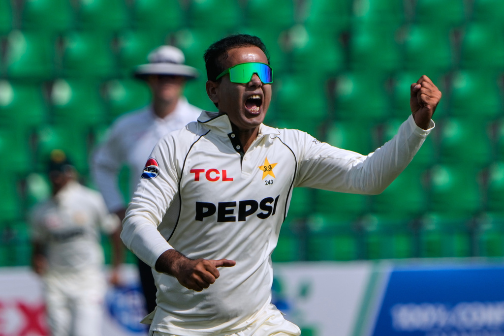 Pakistan's Noman Ali celebrates after taking the wicket of South Africa's Tony dy Zorzi during the third day of the first test cricket match between Pakistan and South Africa, in Lahore, Pakistan, Tuesday, Oct. 14, 2025. (AP Photo/K.M. Chaudary)