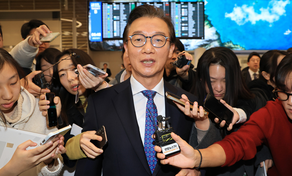 South Korean Oceans Minister Chun Jae-soo answers questions from reporters at the Incheon International Airport in Incheon, South Korea, Thursday, Dec. 11, 2025. (Kim Joo-hyoung/Yonhap via AP)