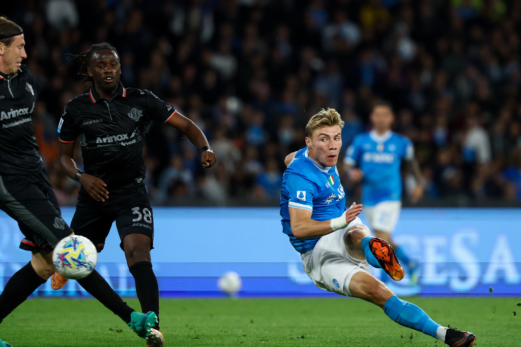 Napoli's Rasmus Hojlund takes a shot which deflected off a Cremonese player for an own goal during the Serie A soccer match between Napoli and Cremonese, Friday, April 24 , 2026, in Naples, Italy. (Alessandro Garofalo/LaPresse via AP)