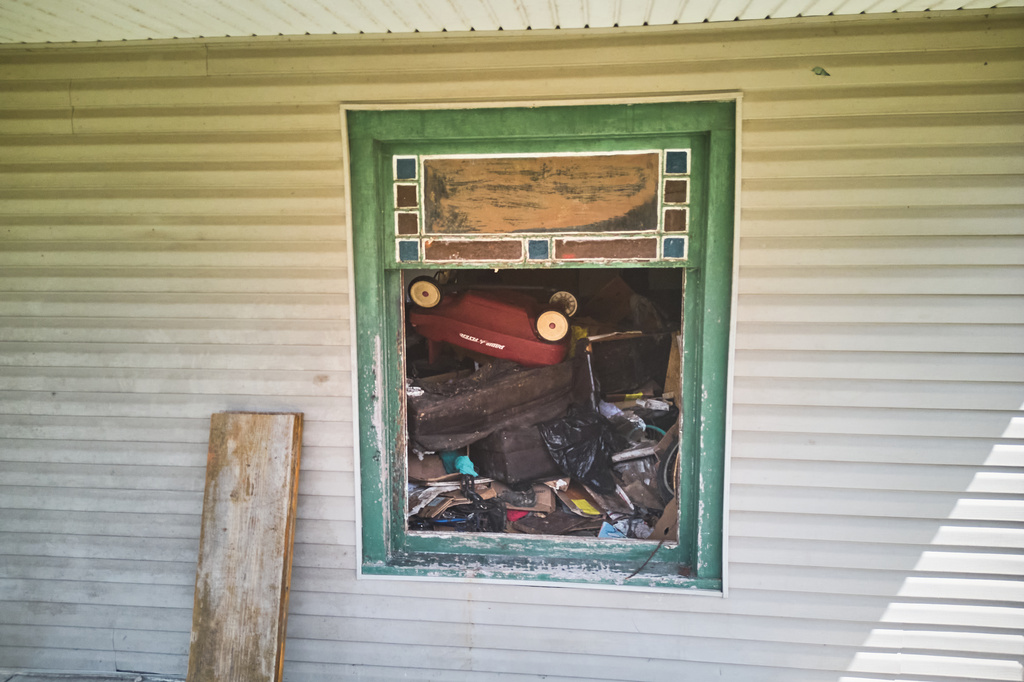 Debris is seen inside a home where authorities say they removed 16 children and arrested four adults in Hamden, Ohio, Wednesday, July 1, 2026. (AP Photo/Carolyn Kaster)