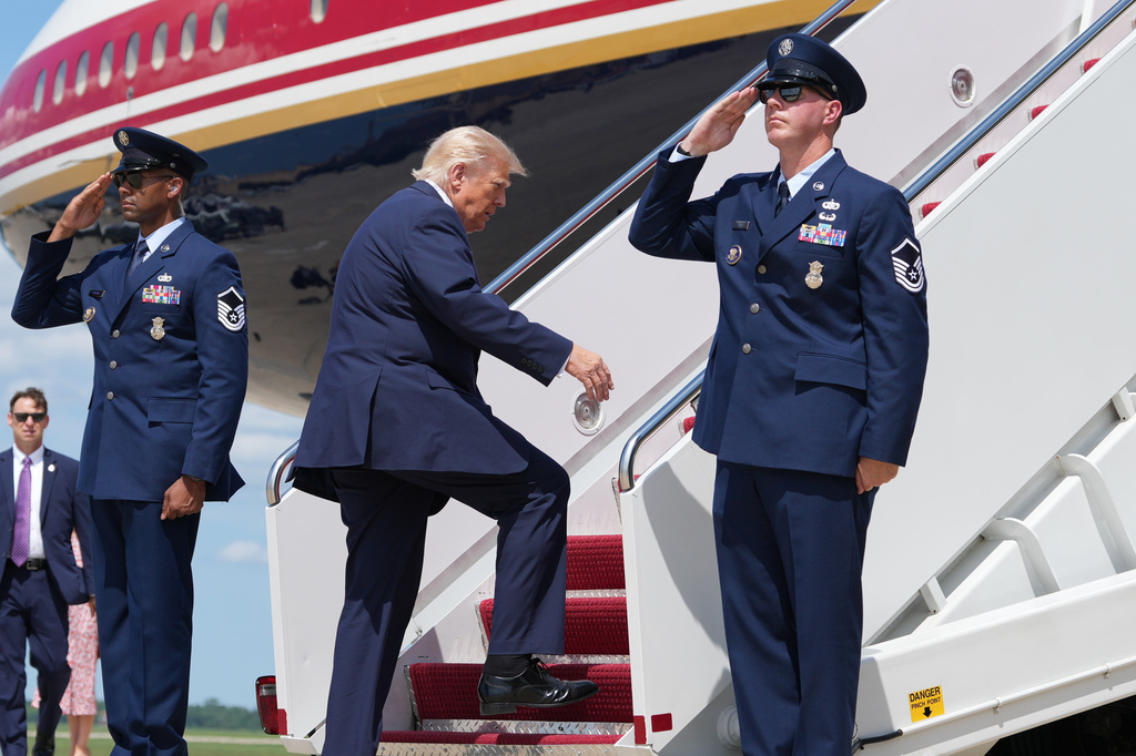 President Donald Trump boards Air Force One, Tuesday, Aug. 4, 2026, at Joint Base Andrews, Md. (AP Photo/Mark Schiefelbein)