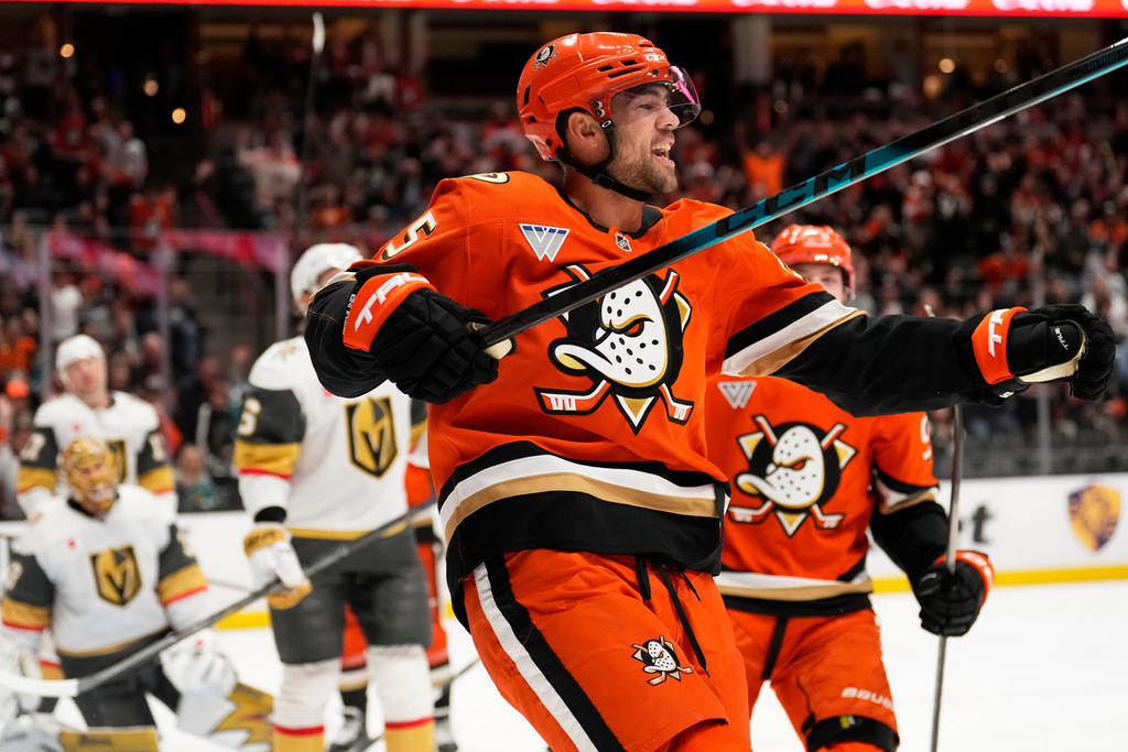 Anaheim Ducks center Ryan Poehling celebrates his assist on a goal by left wing Chris Kreider during the first period of an NHL hockey game against the Vegas Golden Knights, Sunday, Feb. 1, 2026, in Anaheim, Calif. (AP Photo/Mark J. Terrill)
