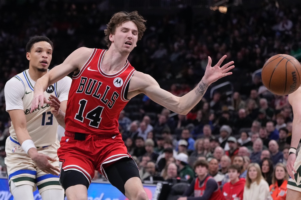 Milwaukee Bucks' Ryan Rollins knocks the ball from Chicago Bulls' Matas Buzelis during the first half of an NBA basketball game Tuesday, Feb. 3, 2026, in Milwaukee. (AP Photo/Morry Gash)