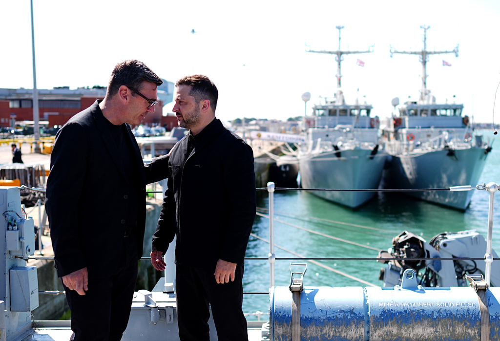 Britain's Prime Minister Andy Burnham, left, and Ukraine's President Volodymyr Zelenskyy view Ukrainian equipment and meet Ukrainian personnel at HM Naval Base in Portsmouth, England, Monday July 27, 2026. (Aaron Chown/Pool Photo via AP)