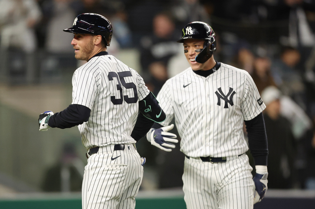 New York Yankees' Cody Bellinger (35) celebrates his two-run home run with Aaron Judge during the fifth inning of a baseball game against the Miami Marlins, Saturday, April 4, 2026, in New York. (AP Photo/Heather Khalifa)