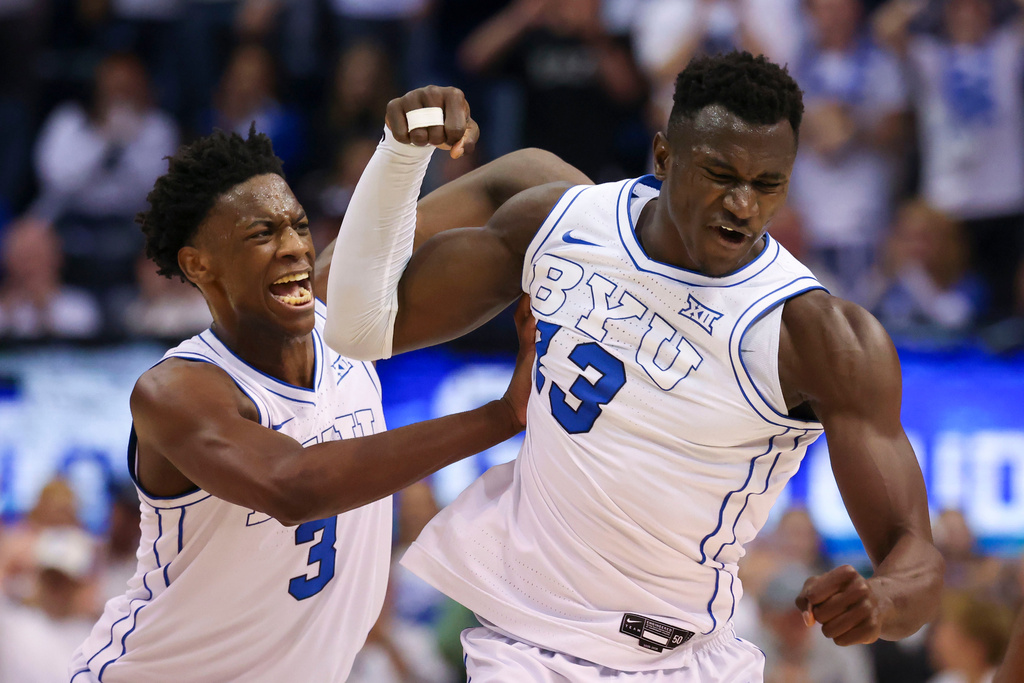 BYU forward AJ Dybantsa, left, and center Keba Keita, right, react after a play against Texas Tech during the second half of an NCAA college basketball game, Saturday, March 7, 2026, in Provo, Utah. (AP Photo/Rob Gray)