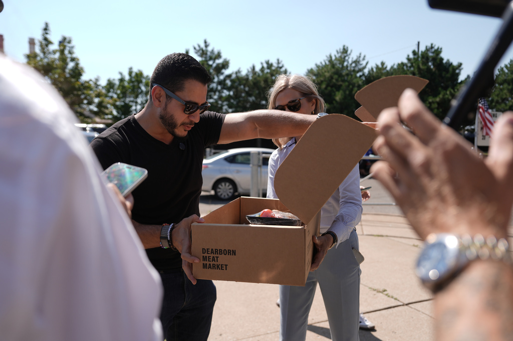 Abdul El-Sayed, a progressive candidate in the Democratic primary for U.S. Senate in Michigan, visits a polling place at Salina Intermediate School on primary election day, Tuesday, Aug. 4, 2026, in Dearborn, Mich. (AP Photo/Julia Demaree Nikhinson)