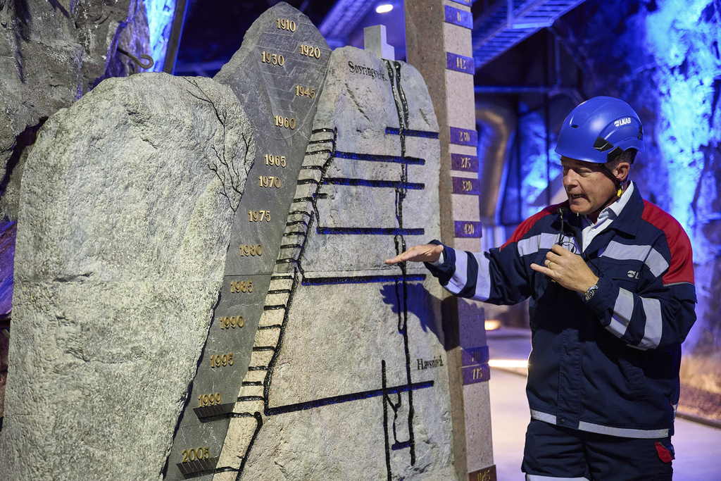 Darren Wilson, LKAB's senior vice president of special products, gestures next to a model of existing mines, in Kiruna, Sweden, Monday, Aug. 18, 2025. (AP Photo/Malin Haarala)
