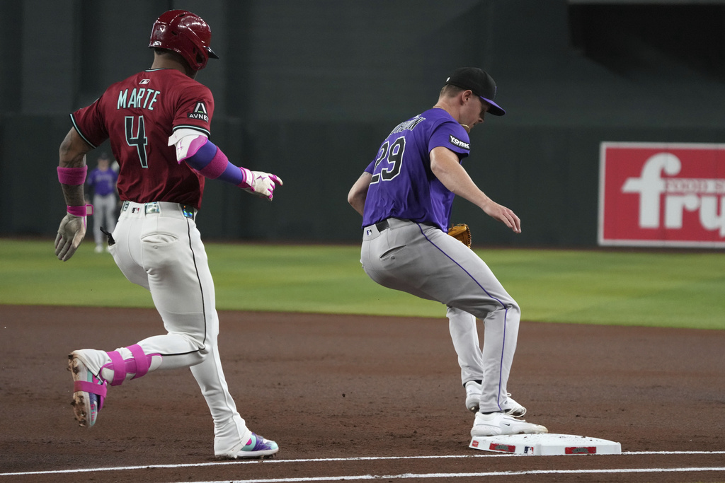 Colorado Rockies pitcher Tanner Gordon gets the out on Arizona Diamondbacks' Ketel Marte (4) in the first inning of a baseball game, Sunday, Aug 10, 2025, in Phoenix. (AP Photo/Rick Scuteri)