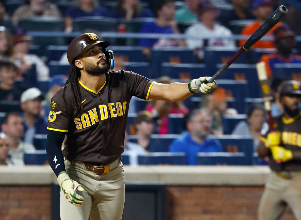 San Diego Padres' Fernando Tatis Jr. follows through on a two run home run against the New York Mets during the fifth inning of a baseball game, Tuesday, Aug. 18, 2026, in New York. (AP Photo/Noah K. Murray)