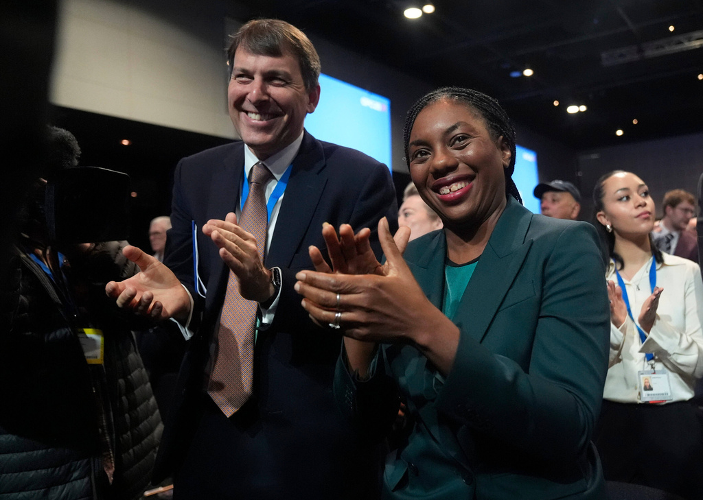 Party leader Kemi Bandenoch, front right, applauds after shadow chancellor Sir Mel Stride made his speech during the Conservative Party Conference in Manchester, England, Monday, Oct. 6, 2025. (Danny Lawson/PA via AP)