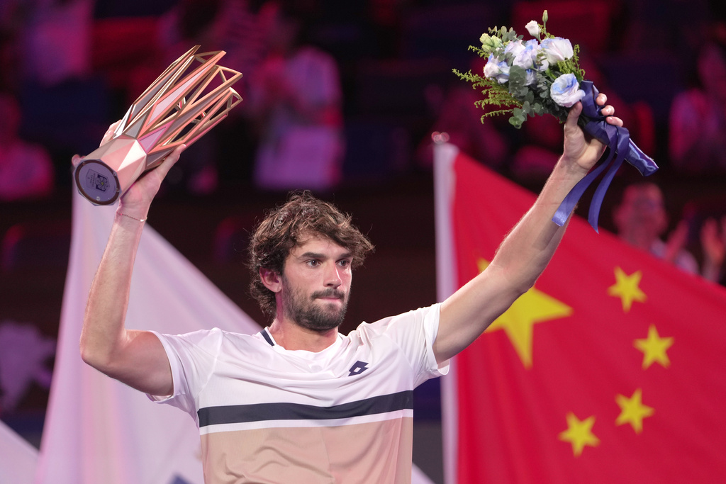 Valentin Vacherot of Monaco celebrates with the trophy after winning the final of the Shanghai Masters tennis tournament defeating Arthur Rinderknech of France at Qizhong Forest Sports City Tennis Center, in Shanghai, China, Sunday, Oct. 12, 2025. (AP Photo/Andy Wong)