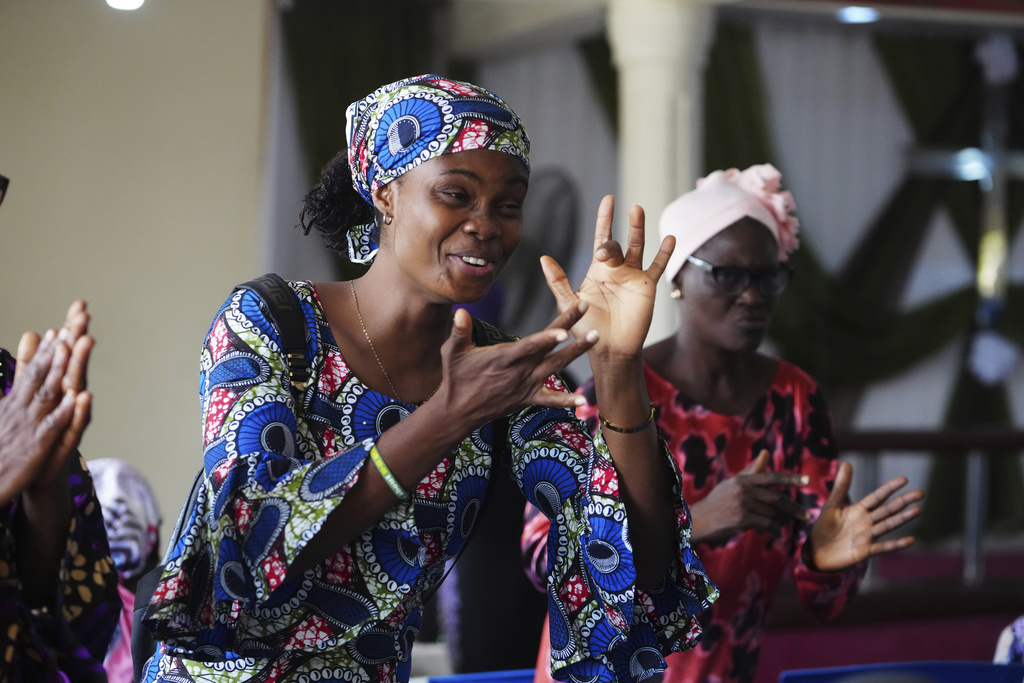 People interact using sign language during a church service at the Christian Mission for the Deaf in Lagos, Nigeria, Sunday, July 13, 2025. (AP Photo/Sunday Alamba)