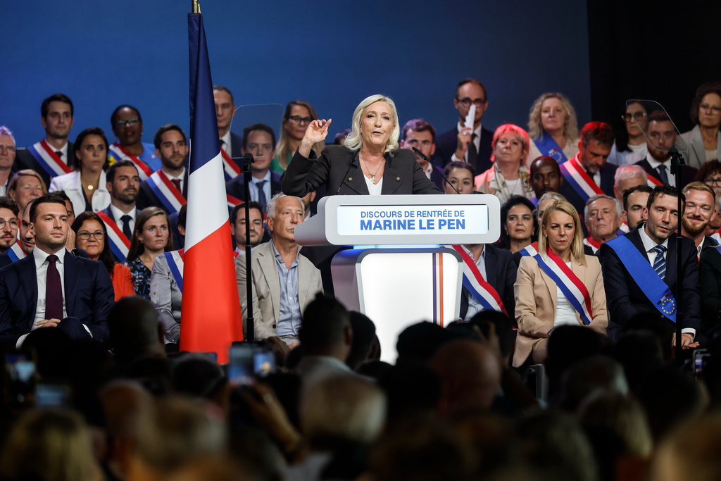 French far-right leader Marine Le Pen delivers her speech, Sunday, Sept.13, 2026 in Henin-Beaumont, northern France. (AP Photo/Jean-Francois Badias)