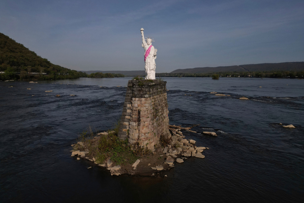 FILE - A miniature replica of the Statue of Liberty stands in the Dauphin Narrows stretch of the Susquehanna River, April 24, 2025, in Dauphin, Pennsylvania. (AP Photo/Carolyn Kaster, File)