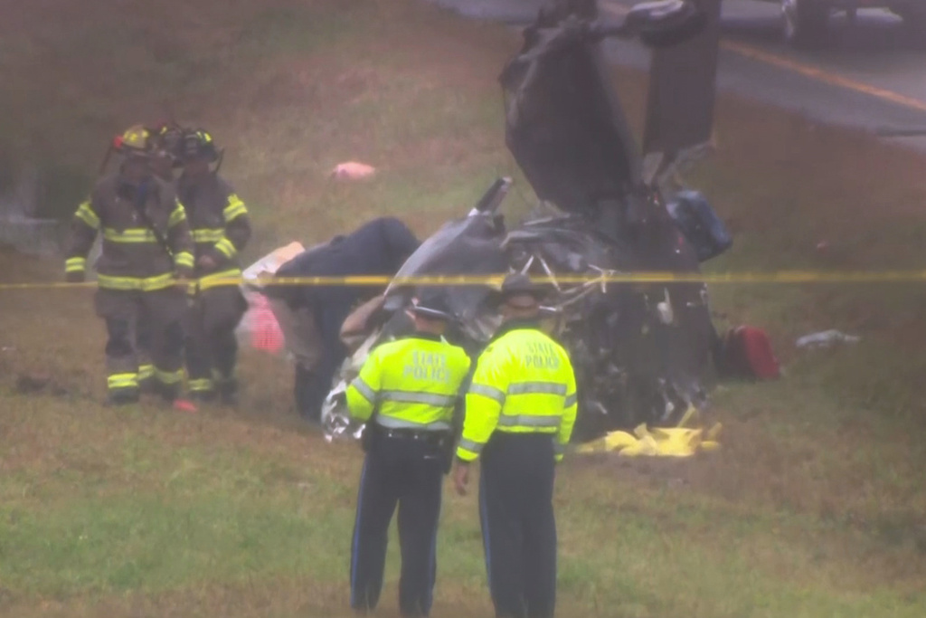 This image made from video provided by WCVB-TV, shows the scene after a small plane crashed onto a highway in Dartmouth, Mass., Monday Oct. 13, 2025. (WCVB-TV via AP)