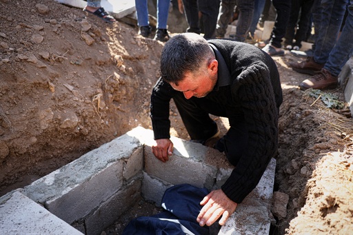 A man weeps over the grave of one of three people killed when gunmen on motorcycles fired on a van near the Druze village of Kafr Maris in Syria's Idlib province, Wednesday, Oct. 22, 2025. (AP Photo/Omar Albam) A man weeps over the grave of one of three people killed when gunmen on motorcycles fired on a van near the Druze village of Kafr Maris in Syria's Idlib province, Wednesday, Oct. 22, 2025. (AP Photo/Omar Albam)
